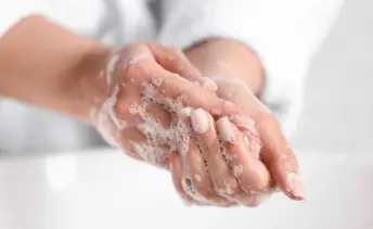 Washing hands with soap image