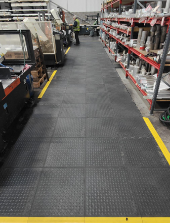 Wharehouse Worker Standing On Comfort Anti Fatigue Mat